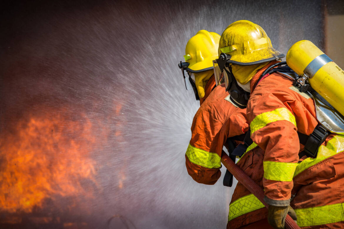 firefighters-hoses-fighting-fire-istock-scaled.jpg
